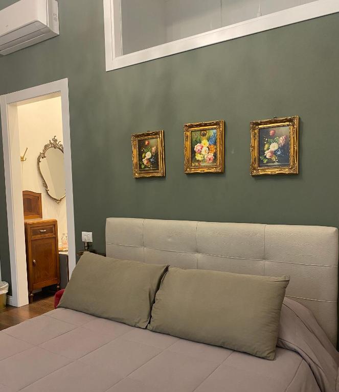 Postel nebo postele na pokoji v ubytování Ortigia Twin Rooms