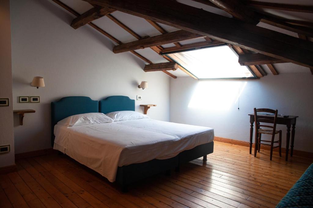 Letto o letti in una camera di Agrilocanda Val Campotto