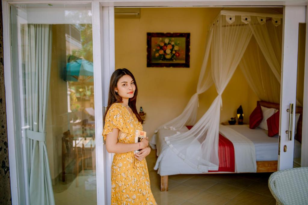 Postel nebo postele na pokoji v ubytování Villa Sekembang Ubud by Purely