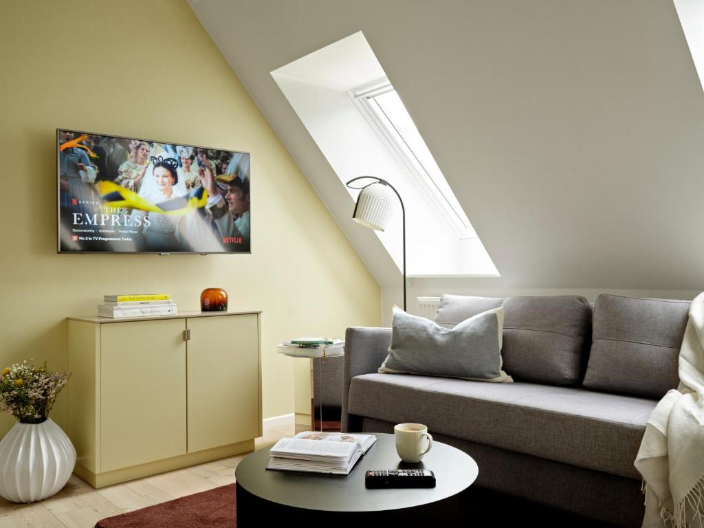 Posezení v ubytování Apēron Apartment Hotel