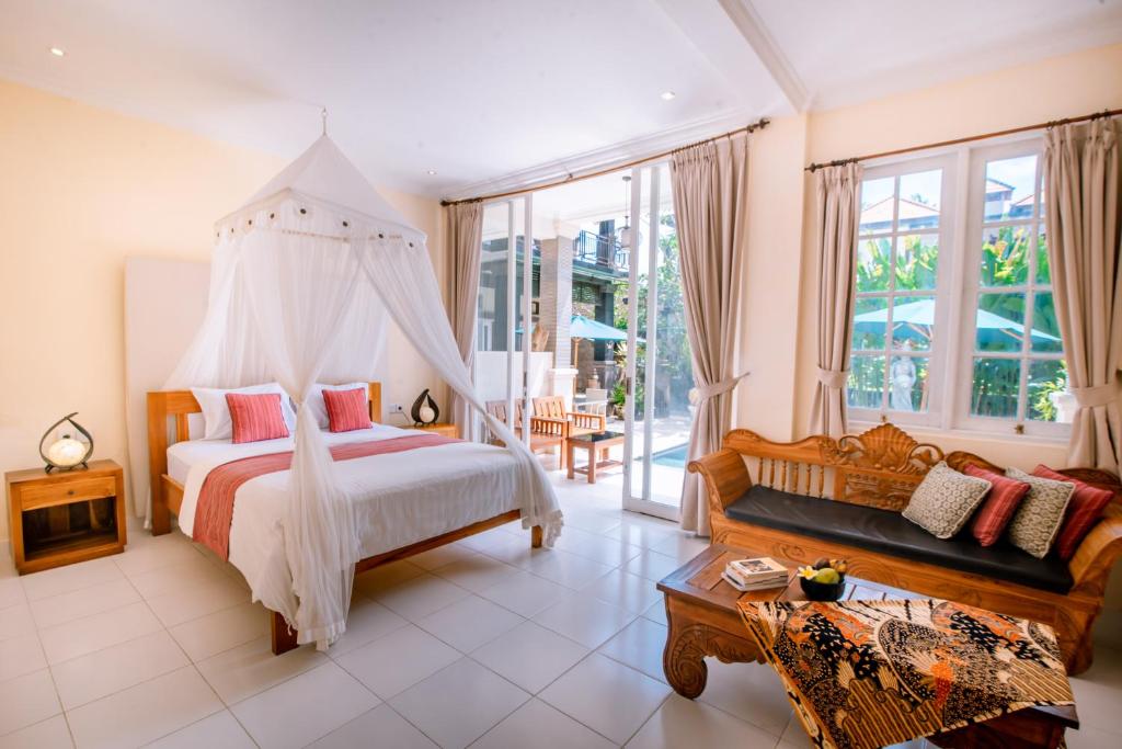 Postel nebo postele na pokoji v ubytování Villa Sekembang Ubud by Purely