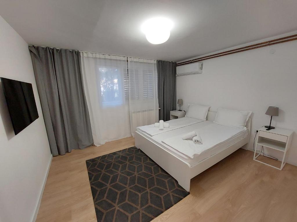 Postel nebo postele na pokoji v ubytování Vrnjci House