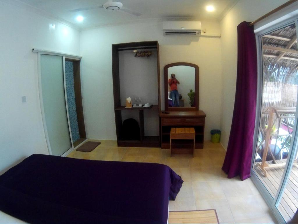 Postel nebo postele na pokoji v ubytování Maafushi View