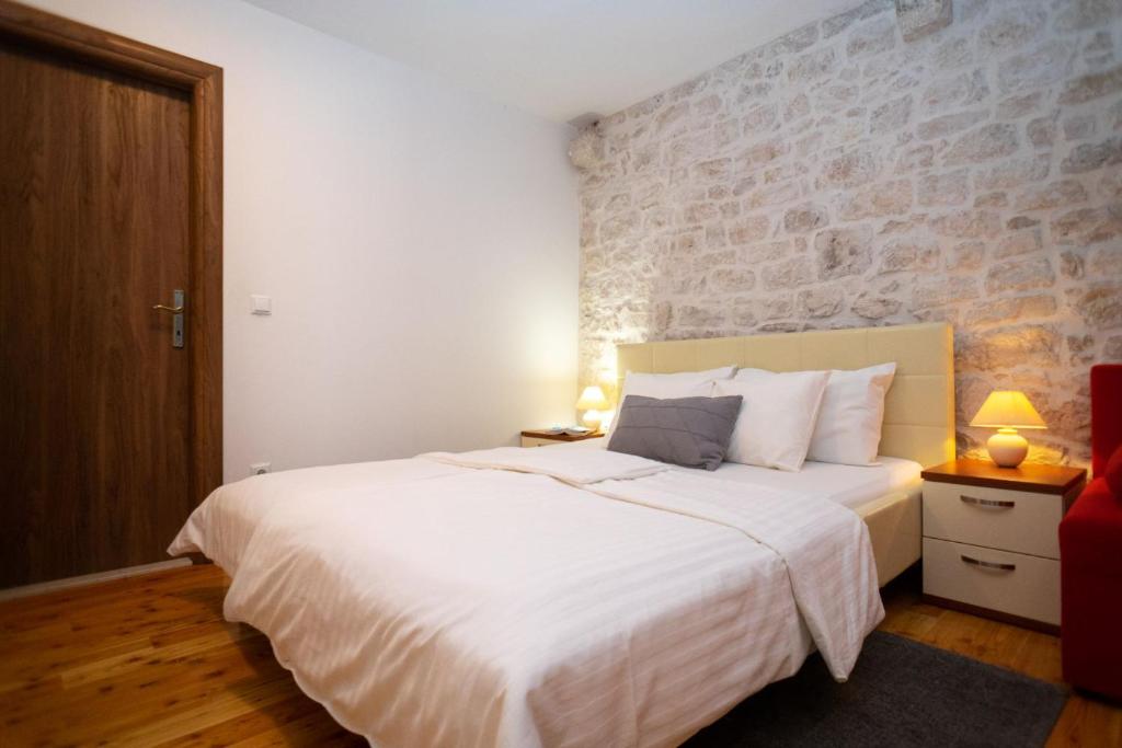 Posteľ alebo postele v izbe v ubytovaní Stone House Marino