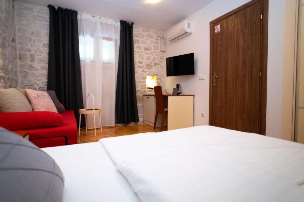 Posteľ alebo postele v izbe v ubytovaní Stone House Marino