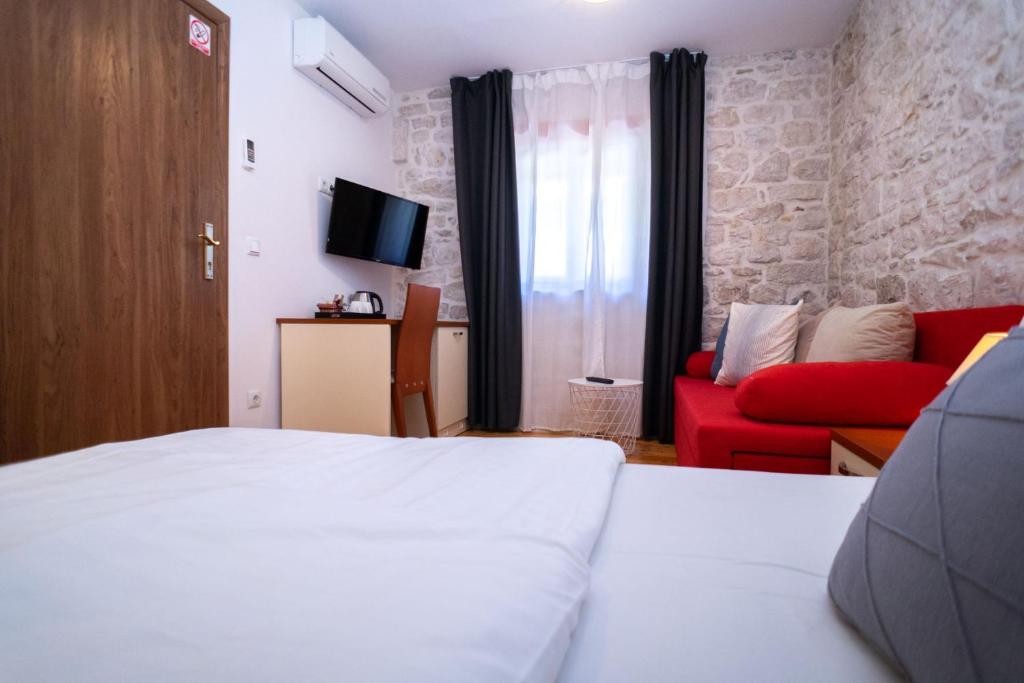 Posteľ alebo postele v izbe v ubytovaní Stone House Marino