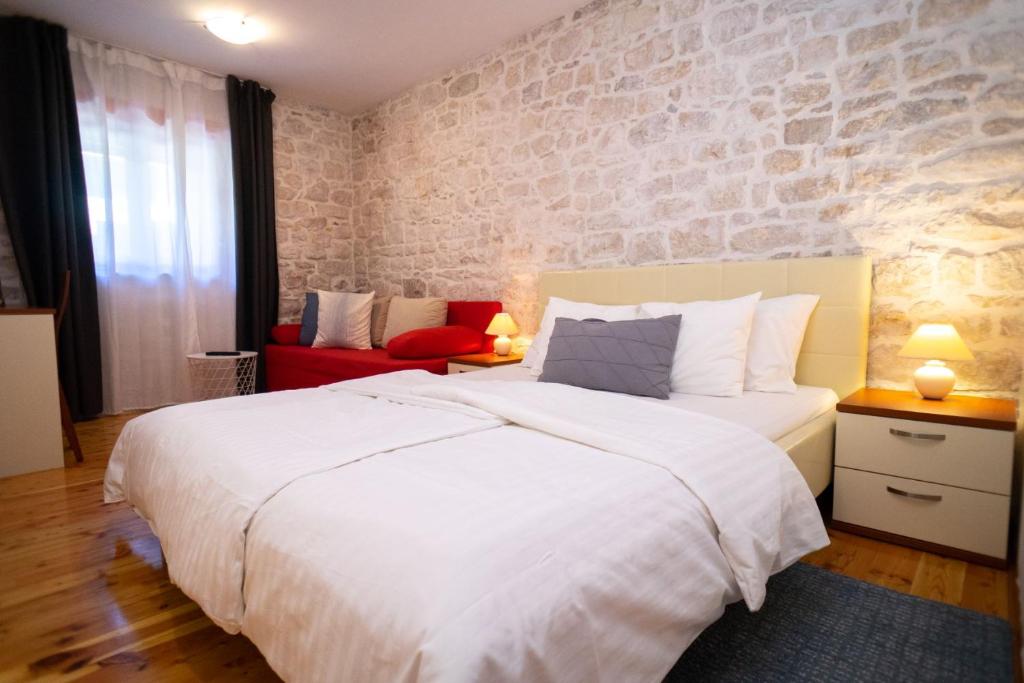 Posteľ alebo postele v izbe v ubytovaní Stone House Marino