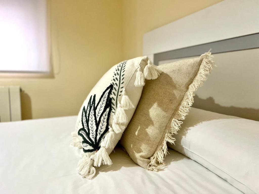 Postel nebo postele na pokoji v ubytování Housing León La Imprenta