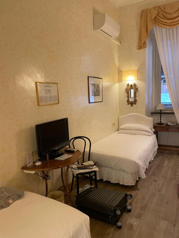 Postel nebo postele na pokoji v ubytování Hotel Fontana