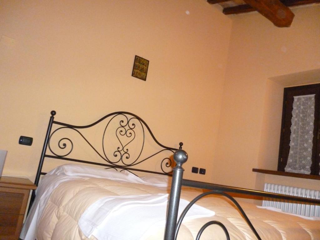 Łóżko lub łóżka w pokoju w obiekcie Agriturismo Ca'Verdeselle