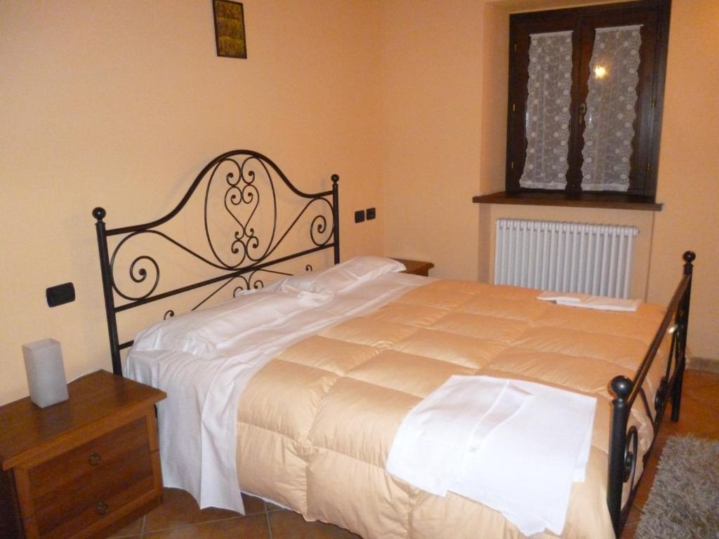 Łóżko lub łóżka w pokoju w obiekcie Agriturismo Ca'Verdeselle