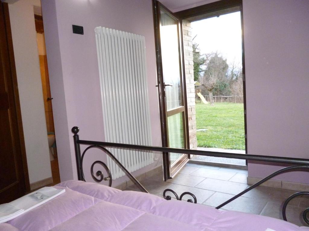 Łóżko lub łóżka w pokoju w obiekcie Agriturismo Ca'Verdeselle