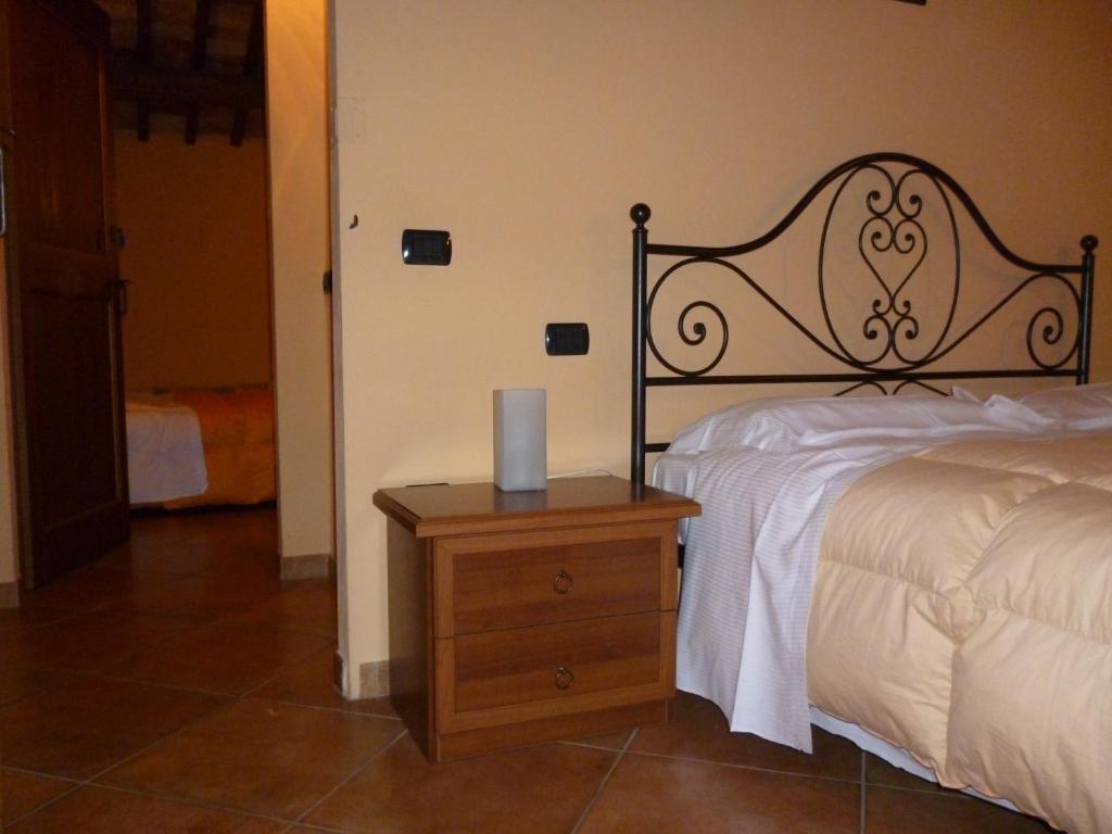 Łóżko lub łóżka w pokoju w obiekcie Agriturismo Ca'Verdeselle