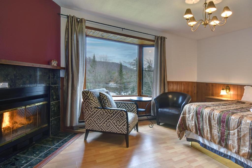 Postel nebo postele na pokoji v ubytování Hôtel du lac Lenore