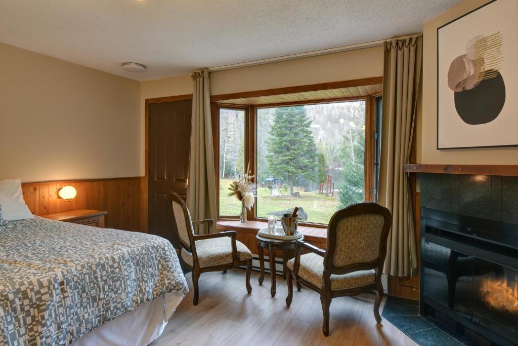 Postel nebo postele na pokoji v ubytování Hôtel du lac Lenore