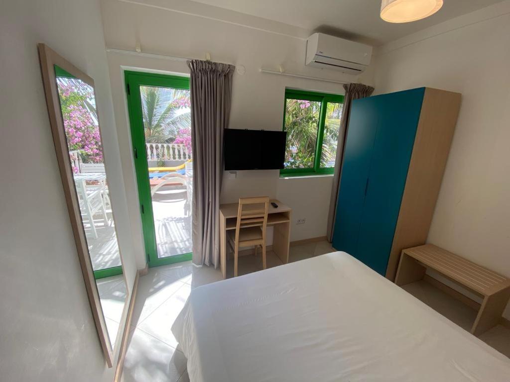Postel nebo postele na pokoji v ubytování ApartHotel NhaTerra