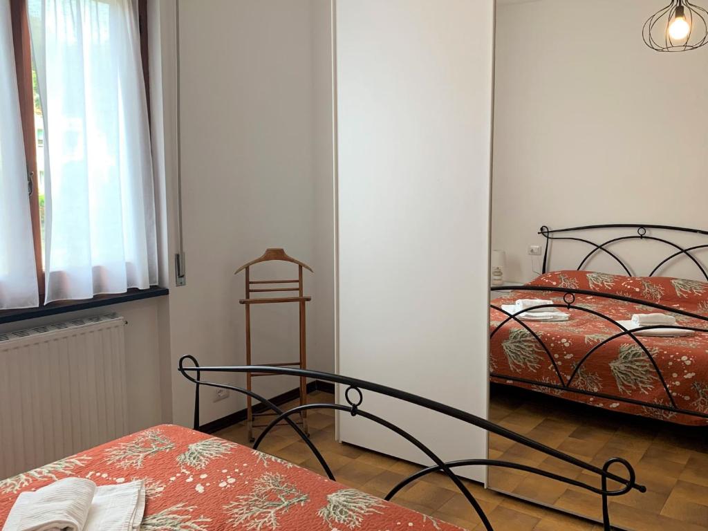 A bed or beds in a room at Lella appartamenti con parcheggio