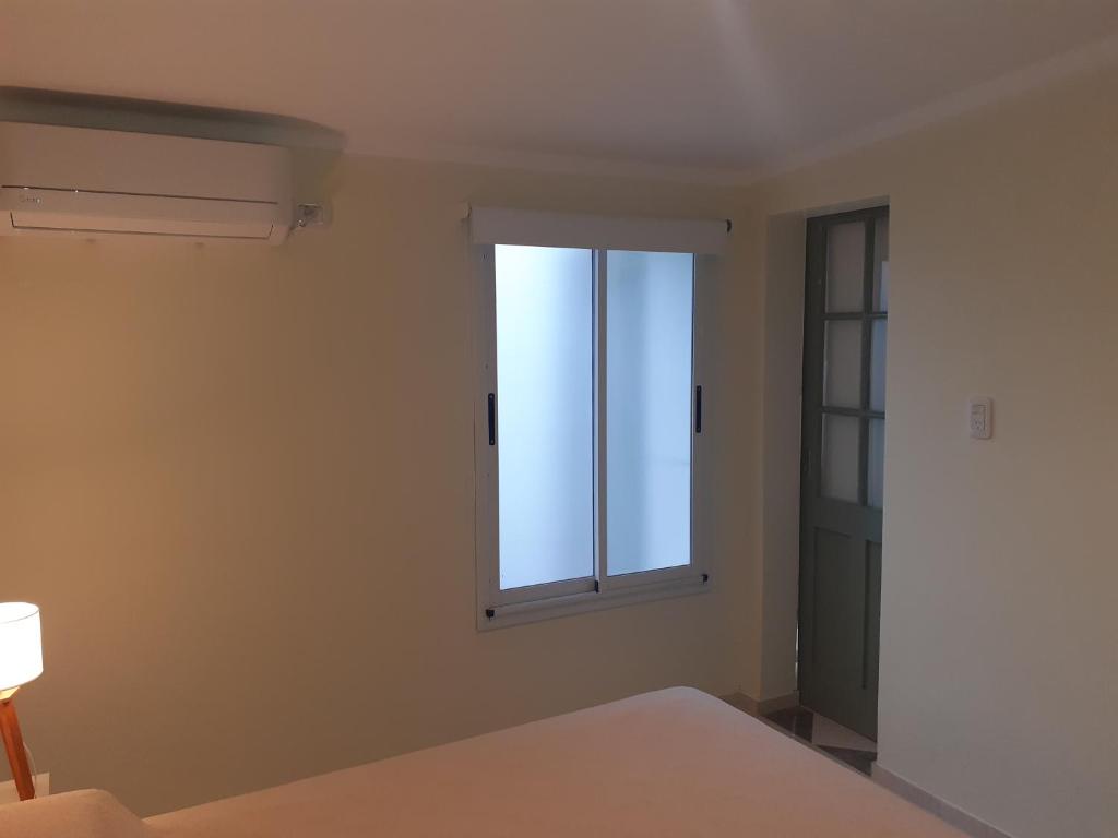 Una cama o camas en una habitación de Bello Jazmin 2