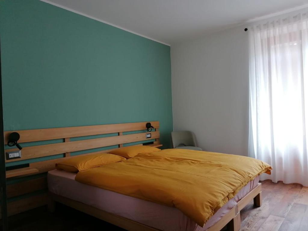 Postel nebo postele na pokoji v ubytování ALPINO B&B