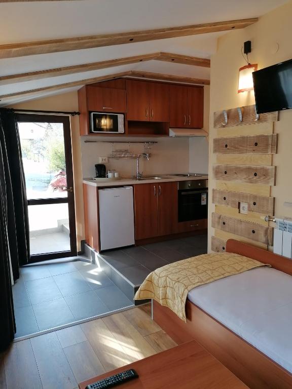 Kuchyň nebo kuchyňský kout v ubytování Boutique Guest House IKONOMOV