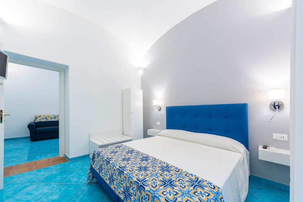 Postel nebo postele na pokoji v ubytování Amalfi Ammorè