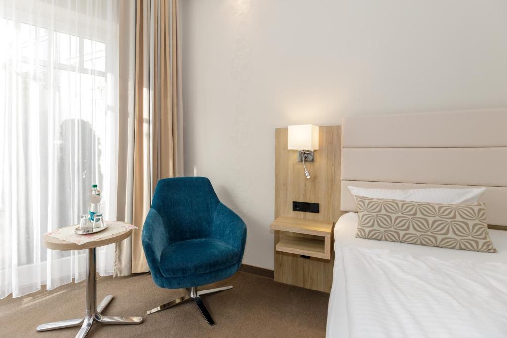 Postel nebo postele na pokoji v ubytování HOTEL am STRAND