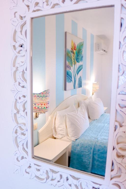 Ocean Point Beach Resort & Spa Adults Onlyにあるベッド