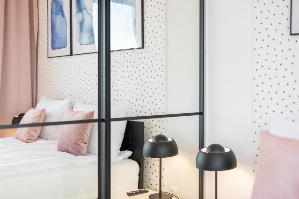 Łóżko lub łóżka w pokoju w obiekcie Klif Apartamenty Nadmorskie Tarasy D601