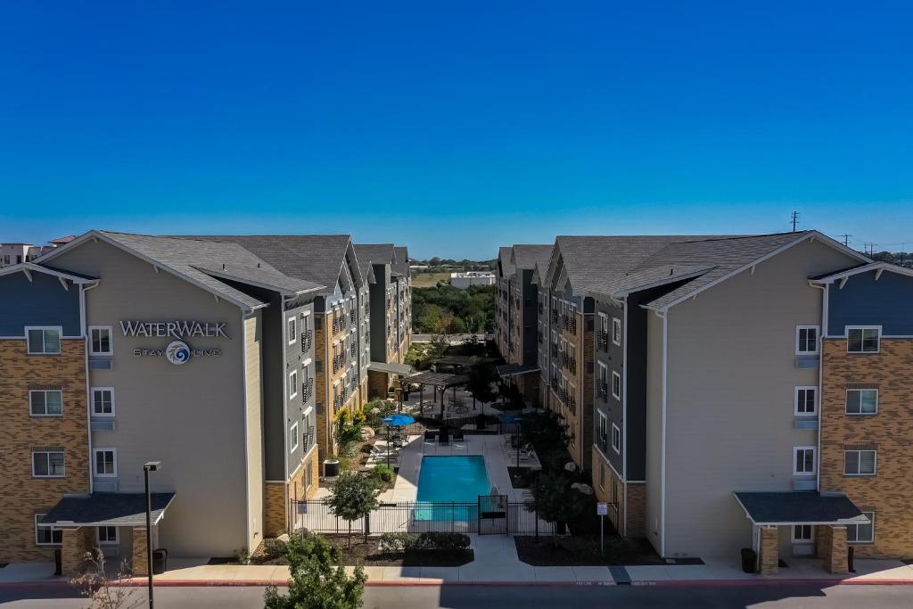 an aerial view of the courtyard of a apartment building at WaterWalk San Antonio at The Rim in San Antonio