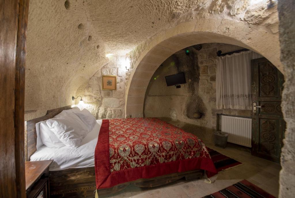 Postel nebo postele na pokoji v ubytování Shiraz Cave Cappadocia