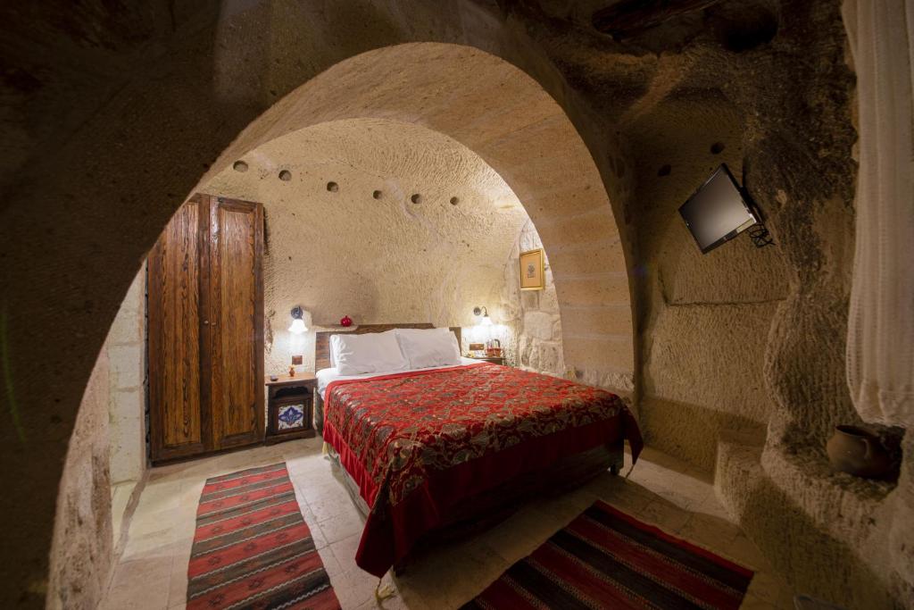Postel nebo postele na pokoji v ubytování Shiraz Cave Cappadocia