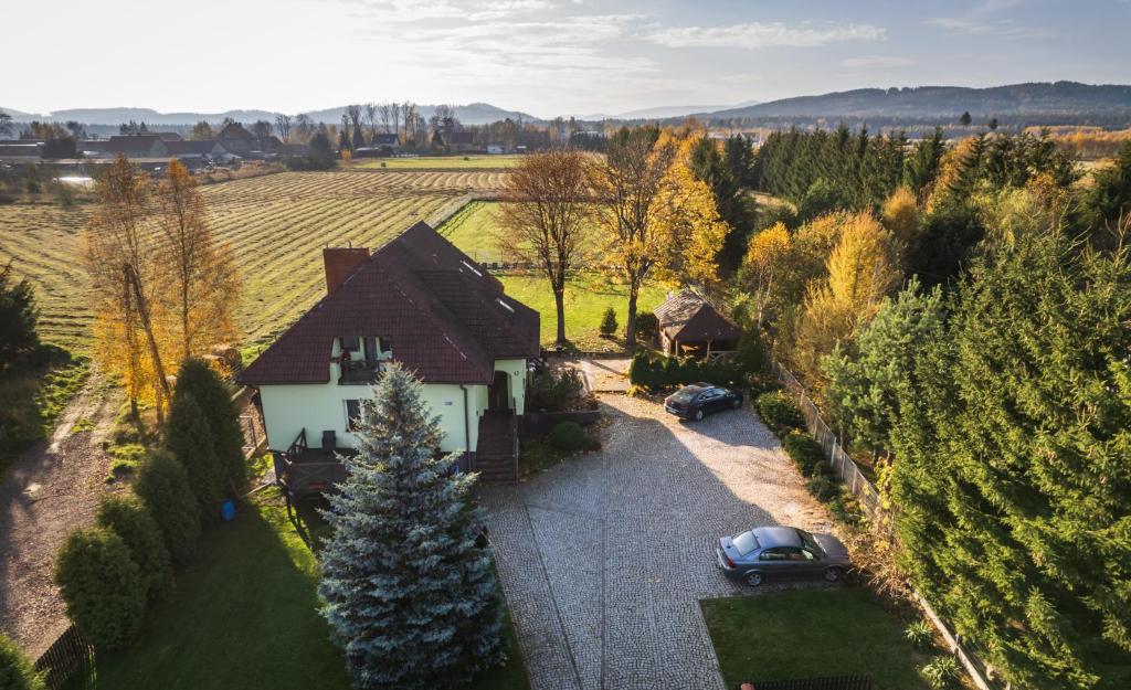 an aerial view of a house with cars parked in a driveway at Na Szlaku in Krzeszów