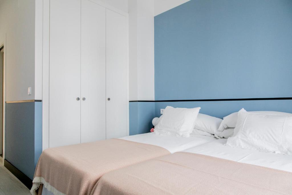 Postel nebo postele na pokoji v ubytování Pasaje Zamora Apartamentos