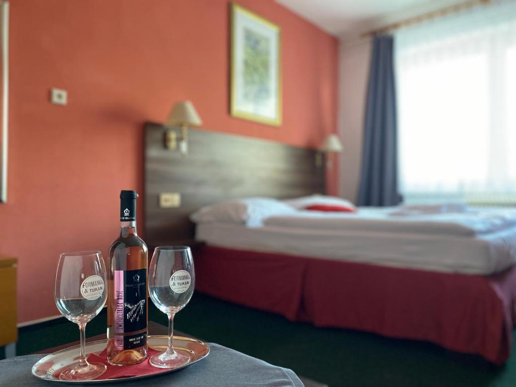 Postel nebo postele na pokoji v ubytování Hotel Formanka