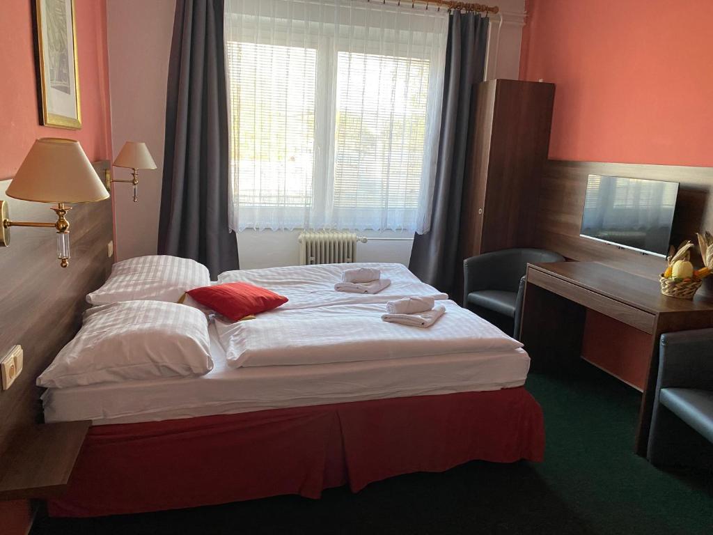 Postel nebo postele na pokoji v ubytování Hotel Formanka