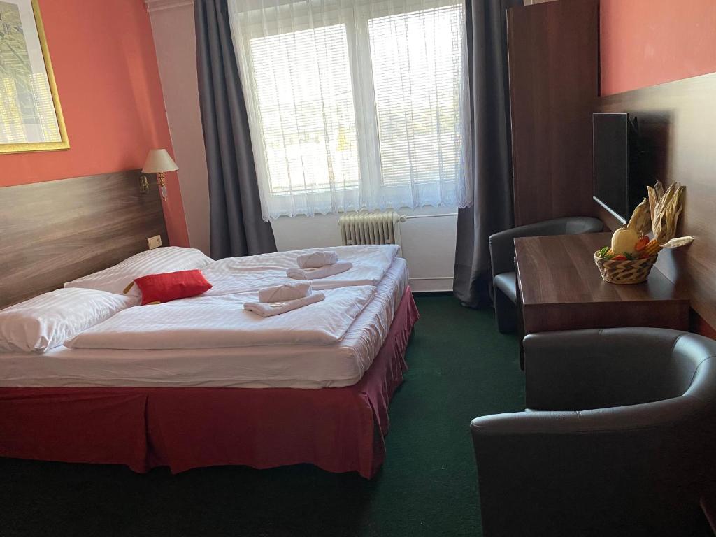 Postel nebo postele na pokoji v ubytování Hotel Formanka