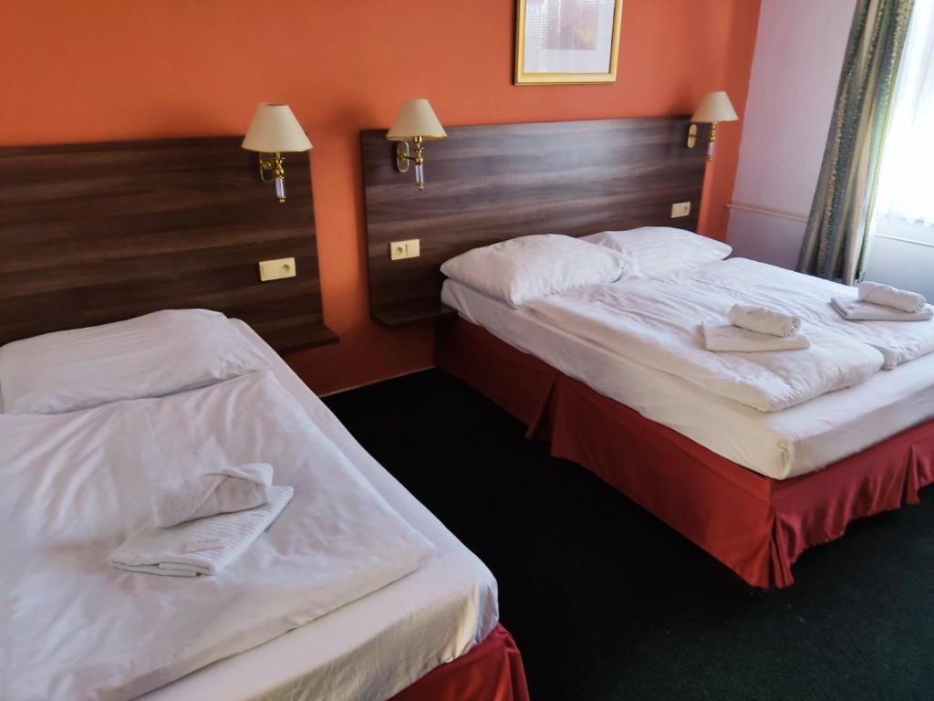 Postel nebo postele na pokoji v ubytování Hotel Formanka