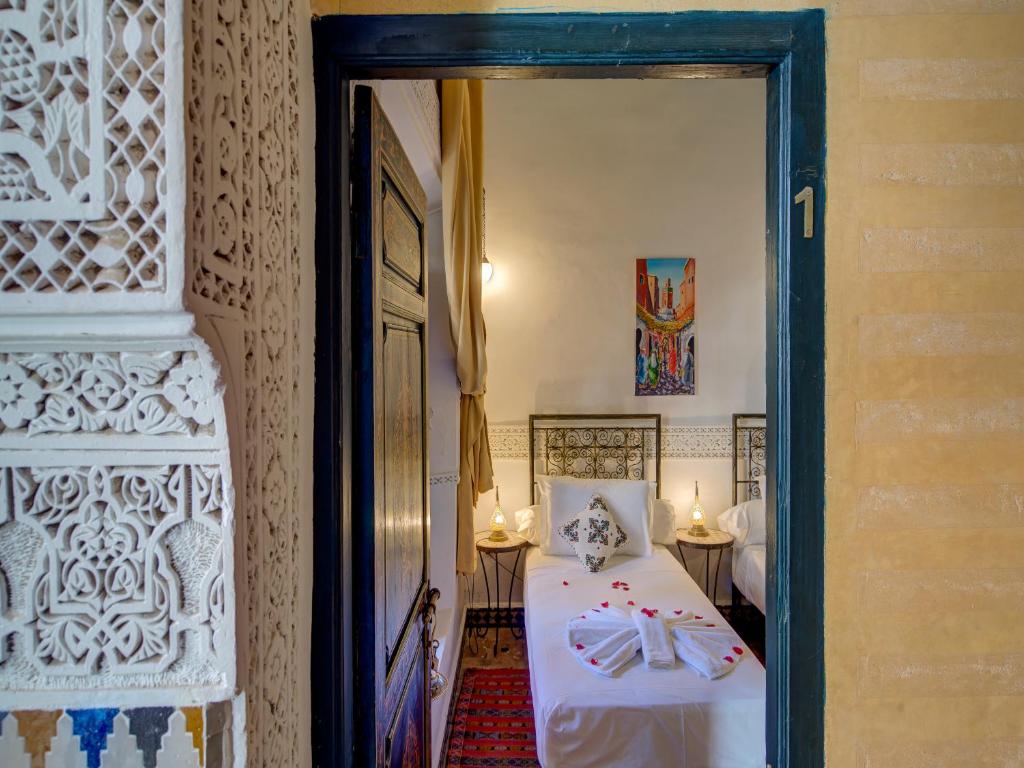 Postel nebo postele na pokoji v ubytování Palais Tinmel Marrakech