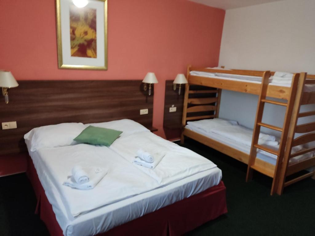 Postel nebo postele na pokoji v ubytování Hotel Formanka
