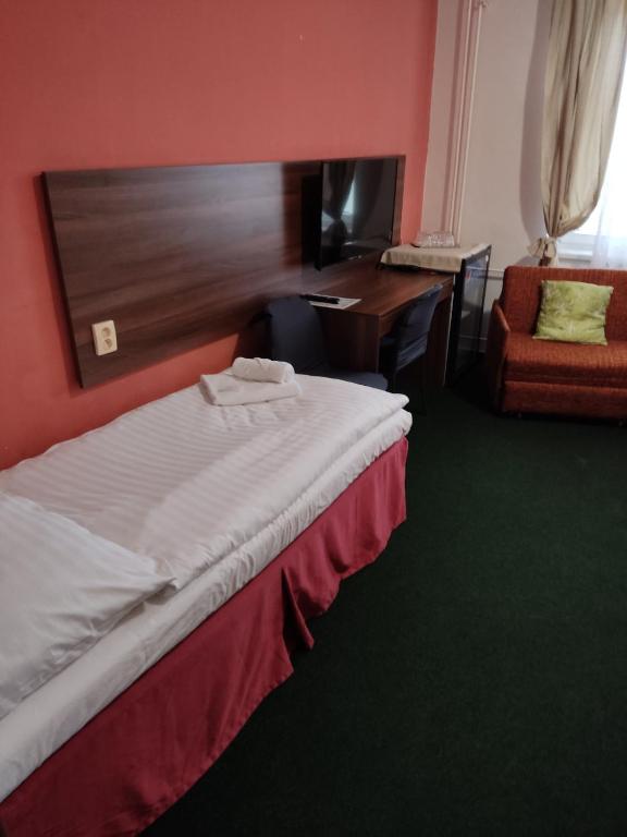 Postel nebo postele na pokoji v ubytování Hotel Formanka
