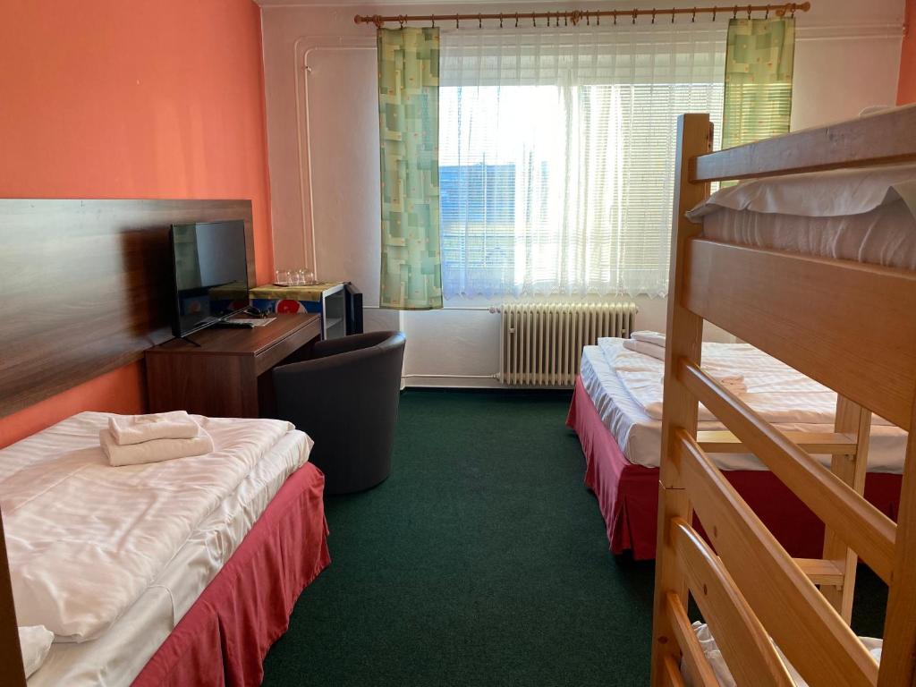 Postel nebo postele na pokoji v ubytování Hotel Formanka