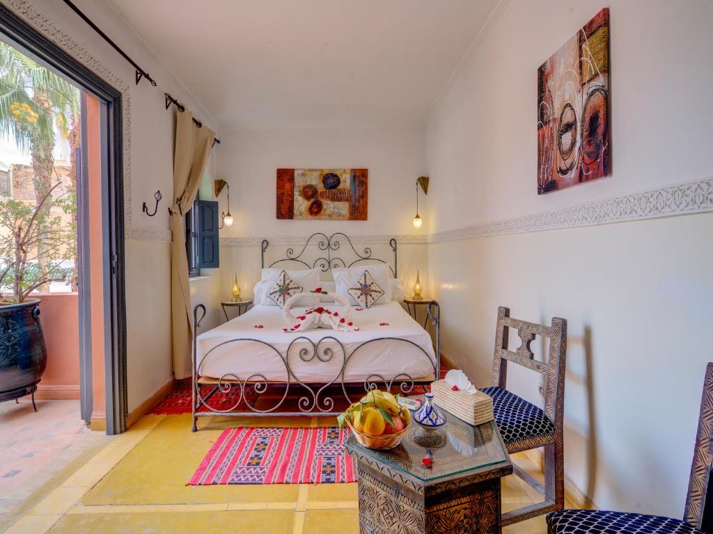 Postel nebo postele na pokoji v ubytování Palais Tinmel Marrakech