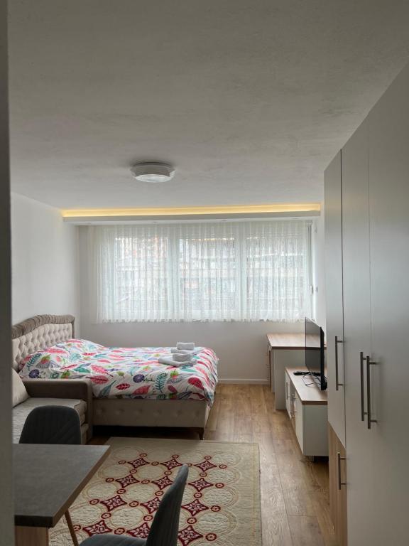 Posteľ alebo postele v izbe v ubytovaní Apartmani IMPERIAL