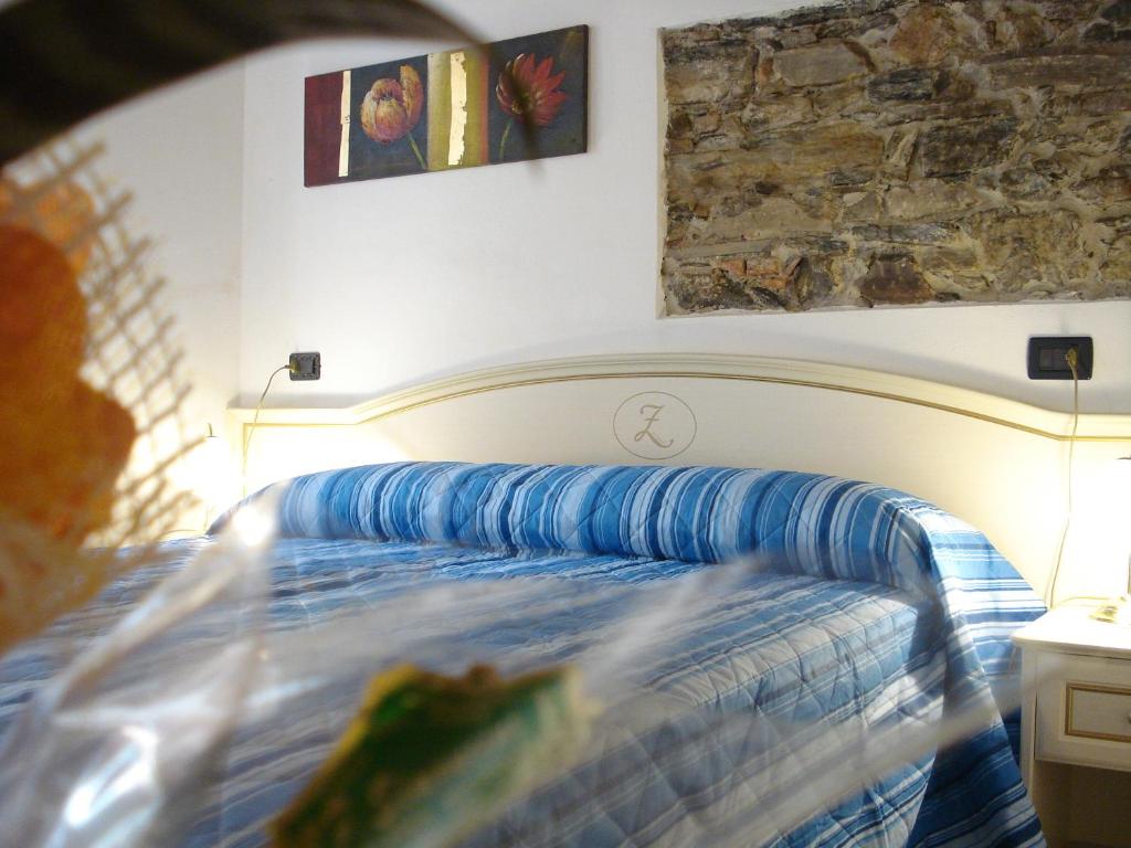 Postel nebo postele na pokoji v ubytování Hotel La Zorza
