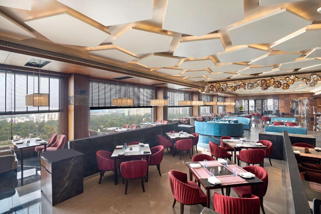 Posezení v ubytování Radisson Blu Towers Kaushambi Delhi NCR