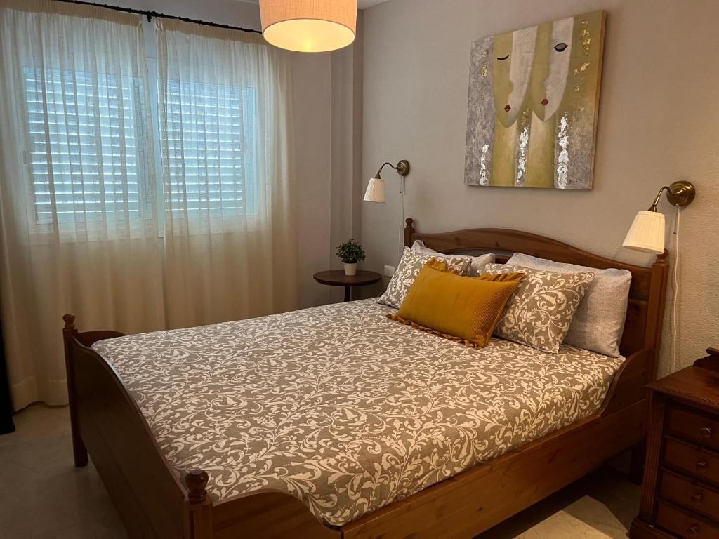 En eller flere senge i et værelse på Tenerife apartamento Sun Beach & Relax