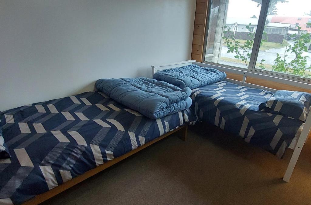 Postel nebo postele na pokoji v ubytování Tongariro Estate