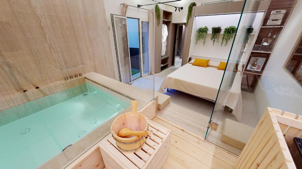 Postel nebo postele na pokoji v ubytování Carletta's Aparta-Suite & Spa