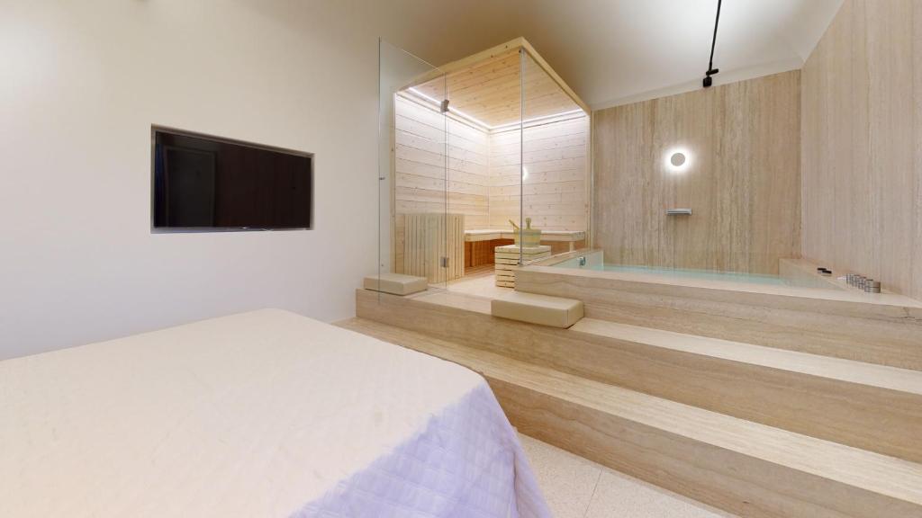 TV a/nebo společenská místnost v ubytování Carletta's Aparta-Suite & Spa