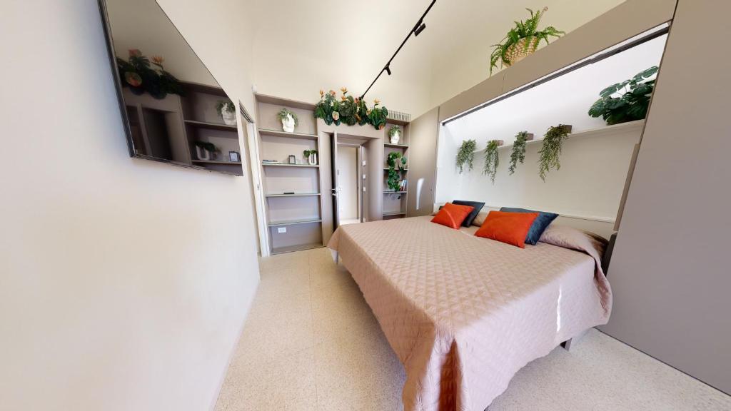 Postel nebo postele na pokoji v ubytování Carletta's Aparta-Suite & Spa